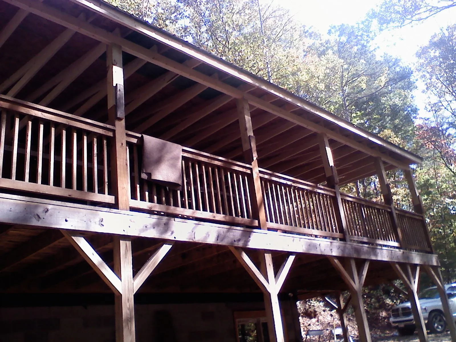 Timber framing under a new elevated porch and deck in Graham